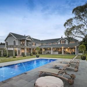 double story house with swimming pool