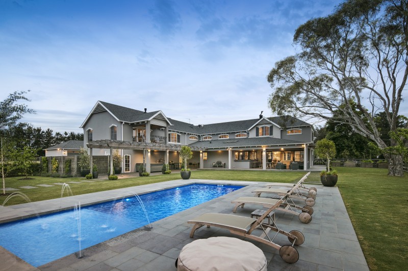 double story house with swimming pool