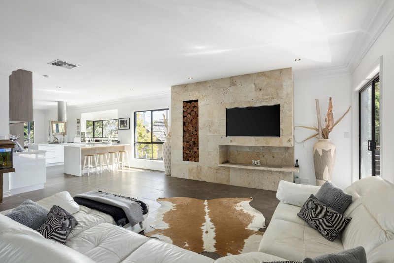 lounge area with tv and cowhide