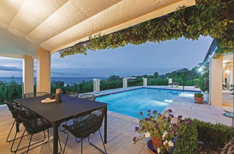 pool and decking overlooking ocean