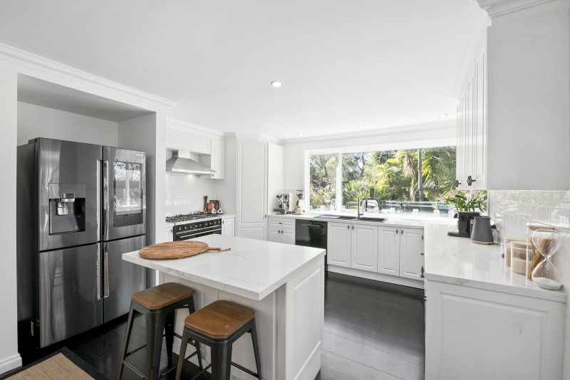 white kitchen with breakfast bar